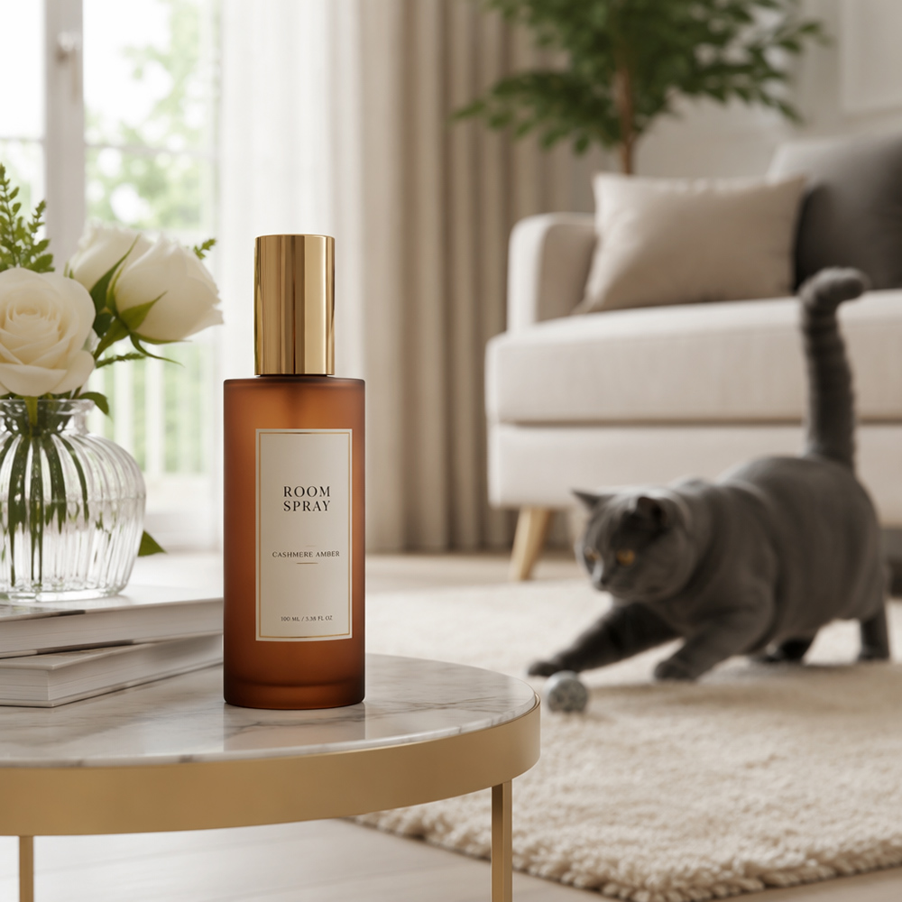 Pet safe home air freshener in a modern living room setting with a cat playing in the background.